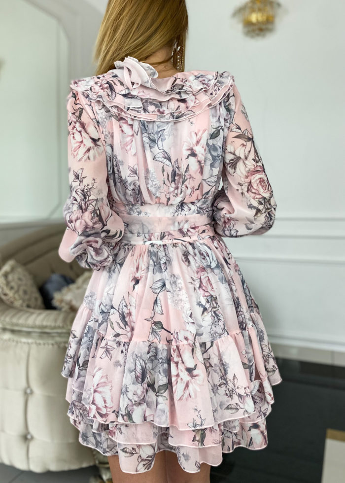 Back view of the Sophia Pink Grey Floral Mini Dress showcasing its elegant floral pattern, layered skirt, and cinched waist for a stylish look.