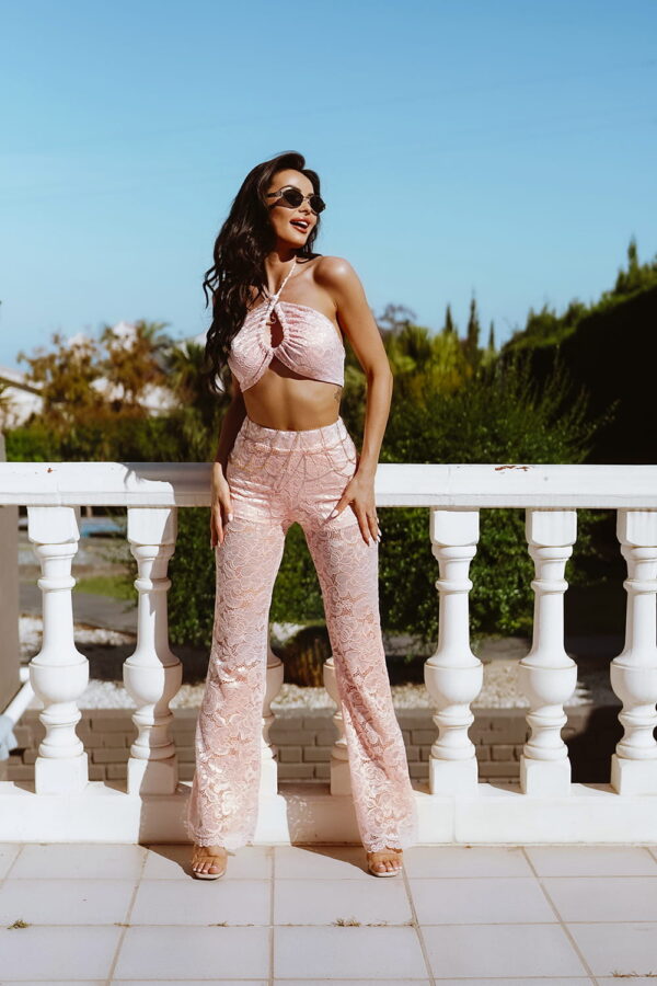 Model wearing a Lace Bralette with Trousers Co-ord Two Piece Set in Pink, perfect for summer outings, featuring intricate lace patterns and halter neck detail.